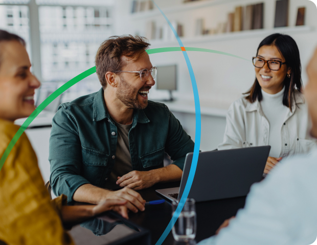 employees smiling while having a discussion