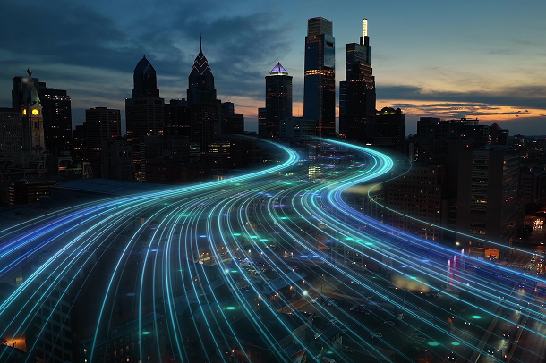 a futuristic visual depicting a data stream over a city landscape