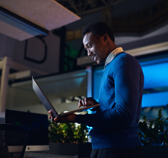 a man looking at a laptop screen