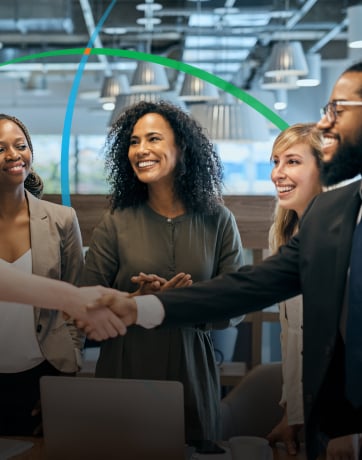 banner showing business professionals smiling and shaking hands in a conference room