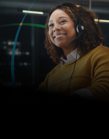 banner showing a woman with a headset smiling while working on her laptop 